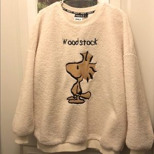 A very cute sweatshirt featuring PEANUTS